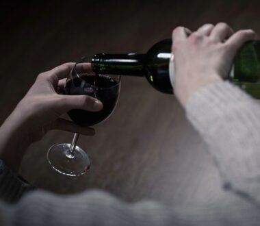 red wine is poured into a wine glass